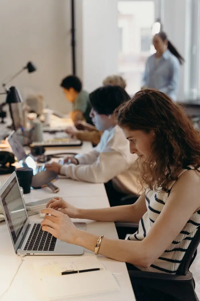 Team of diverse professionals collaborating in a modern office setting.